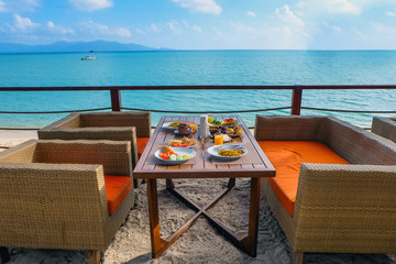 Breakfast outside at the hotel by the sea - obrazy, fototapety, plakaty
