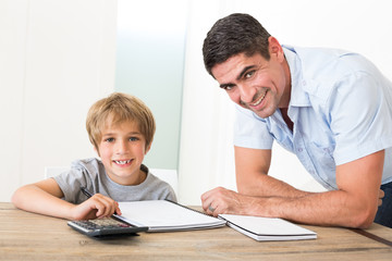 Father assisting son with homework