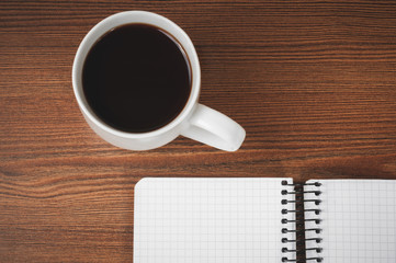 Blank notepad and coffee cup