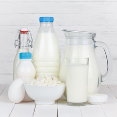 Dairy products isolated on white wooden table
