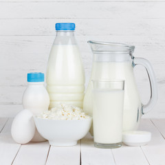 Dairy products on white wooden table