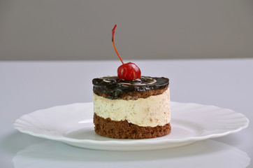 The small cake with cherry