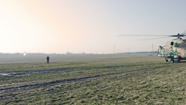 Soldiers waiting for the order to get into the helicopter.