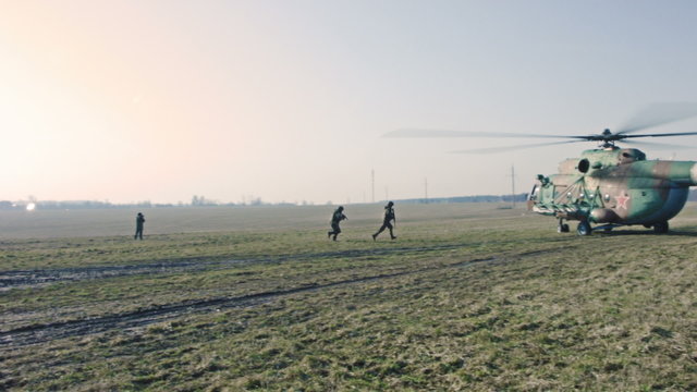 Soldiers getting into the helicopter.
