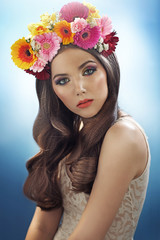 Fototapeta premium Young pretty girl with the flower hat