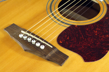 Classic acoustic guitar natural color top fragment closeup