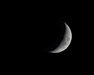 Obraz premium Moon Phase isolated on black - Waxing Crecent