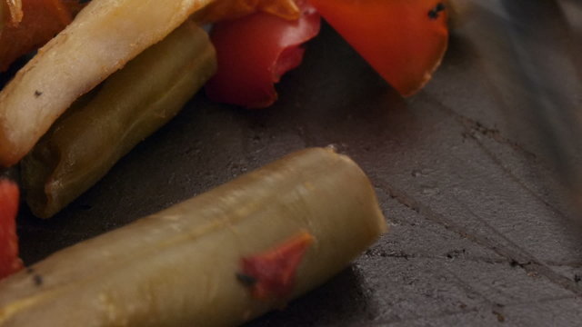 scratching pan teflon surface with a fork while mixing vegetable