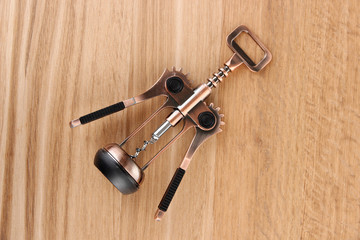 Corkscrew on wooden background