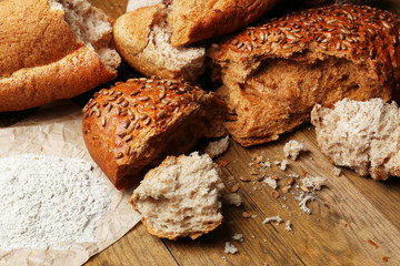 Breaking bread on wooden table