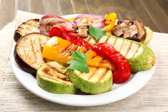 Fototapeta Delicious grilled vegetables on plate on table close-up