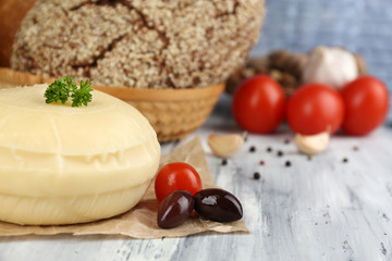 Tasty Italian cheese on wooden table
