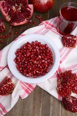 Ripe pomegranates on table close-up