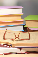 Composition with glasses and books,