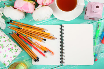 Composition with notebook and pencils on wooden table close-up