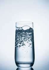 water glass on blue background