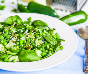 Green salad with spinach,pepper,sweet peas and parmesan on rusti