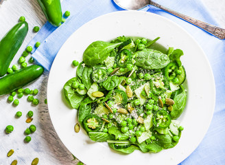 Green salad with spinach,pepper,sweet peas and parmesan on rusti