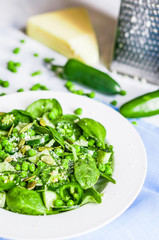 Green salad with spinach,pepper,sweet peas and parmesan