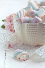 Pastel colored marshmallows in a bowl, closeup shot, toned photo