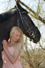 Naklejka premium horse and blonde woman