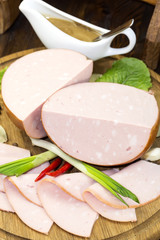 sausage on a wooden plate in a restaurant