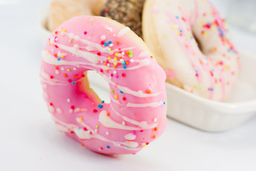 Group of glazed donuts, isolated on white background
