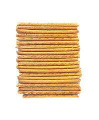 Salted sticks arranged horizontally on white