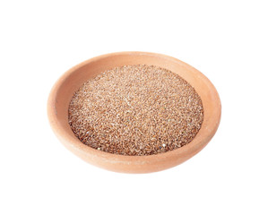 Flax seeds in a clay bowl isolated on white
