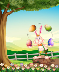 A rabbit juggling the Easter eggs
