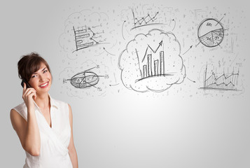 Obraz premium Business girl presenting hand drawn sketch graphs and charts