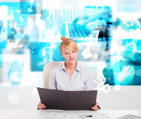 Business person at desk with modern tech images at background
