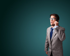 Young man making phone call with copy space