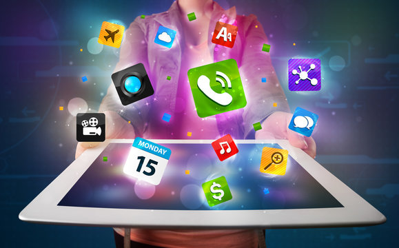 Lady holding a tablet with modern colorful apps and icons
