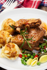 Pork spareribs served with mashed potatoes