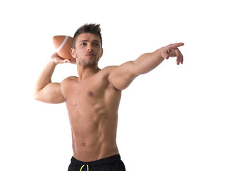 Muscular american football player shirtless ready to throw ball © theartofphoto