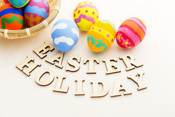 Colourful easter egg with wooden text