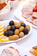 olives and lemon slices on a plate