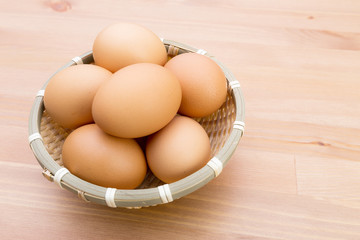Brown egg in basket