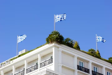 Fotobehang greek flags on a roof garden © smoxx