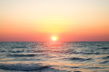 Plakaty  sea against the sunset sky.
