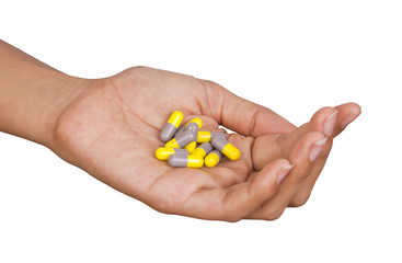 Medicine capsules on hand