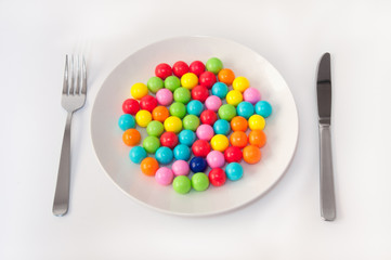 Gum Balls on the Plate with Knife and Fork.