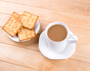 Coffee cup on the table with bread sticks.