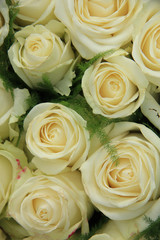 White roses in a wedding arrangement