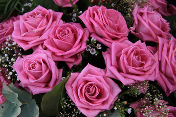 Big pink roses in a bridal bouquet