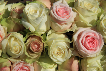 White and Pink roses in wedding arrangement