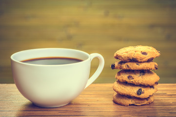 White cofee cup with batch of cookies