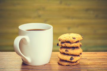 White cofee cup with batch of cookies