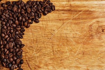 Coffee beans on wooden background